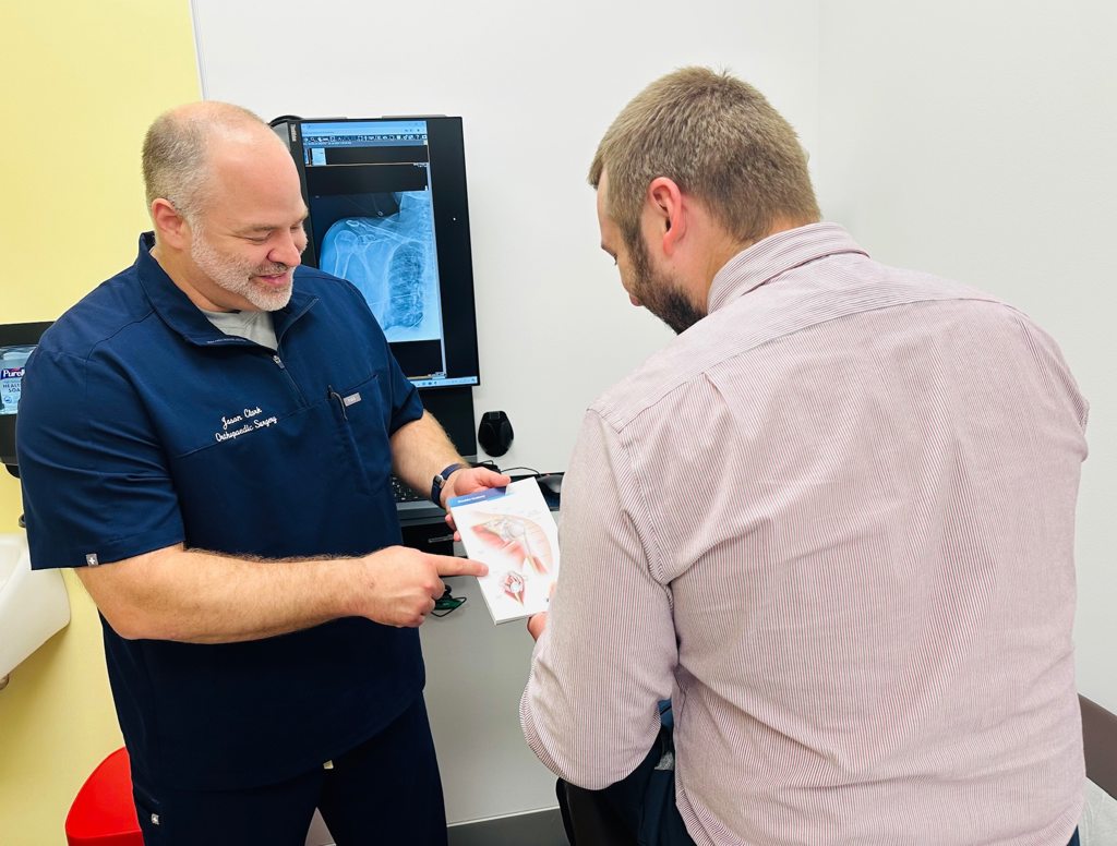 Dr Clark with patient at Pen Highlands State College